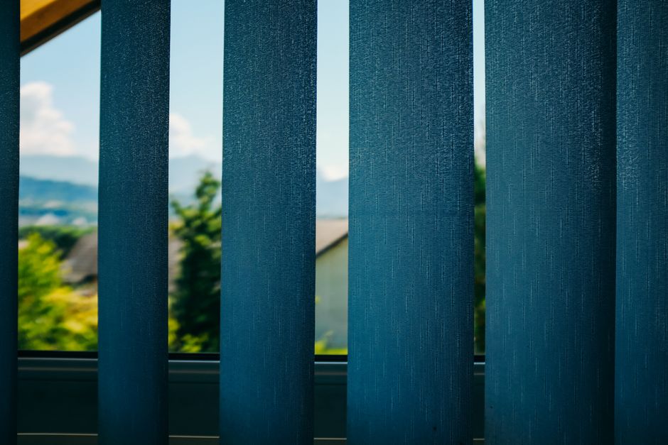 Sunlight filtering through modern window shades